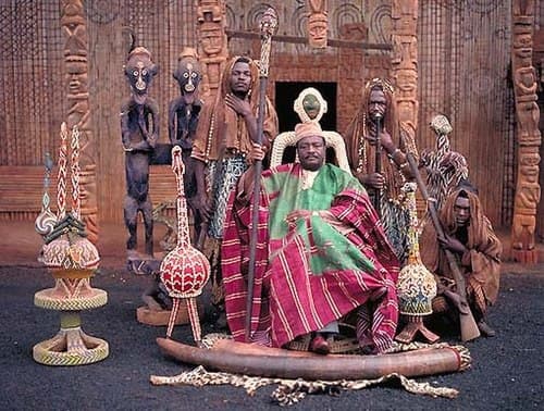 Cameroon Grasslands royal beaded mask covered in blue, red, and white bead patterns with geometric eye designs
