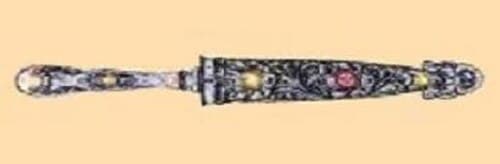 A decorative silver-handled gaucho facón in an ornate leather sheath with silver fixtures and traditional Pampas engravings